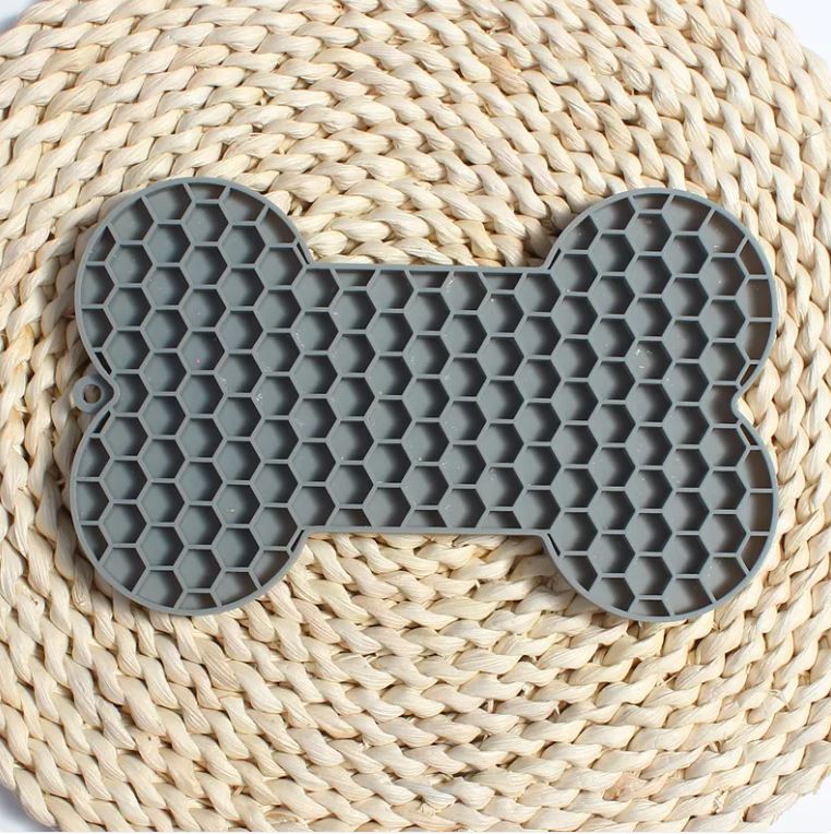 Bone-shaped lick mat textured surface detail